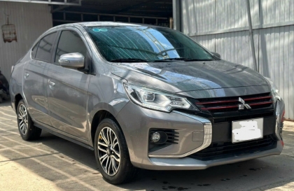 Mitsubishi Attrage lắp khóa cửa tự động thì có mất tính năng lên xuống kính không?