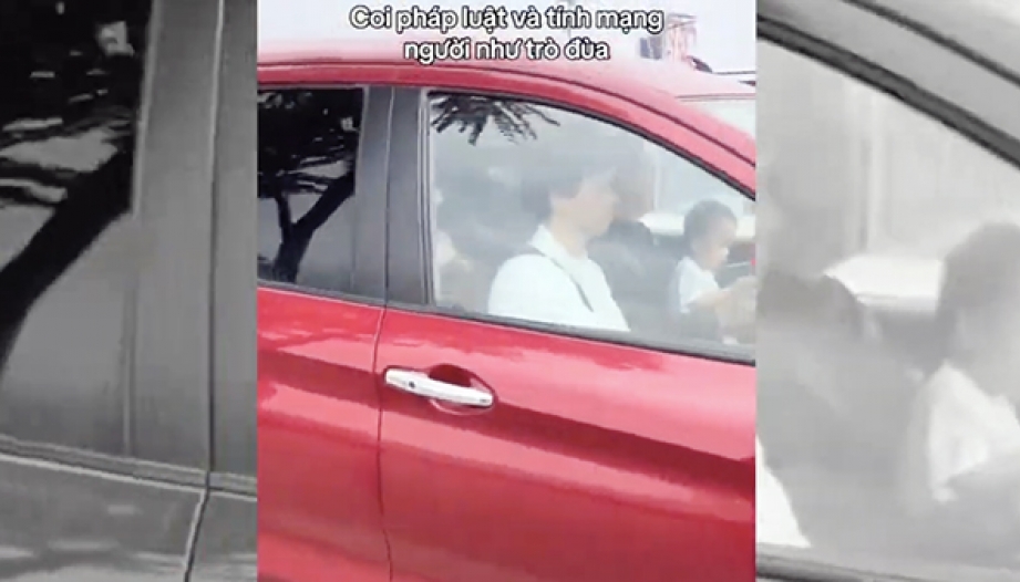 Ý thức Giao thông: CSGT xác minh tài xế Suzuki Ertiga vừa ôm trẻ em vừa lái xe trên đường